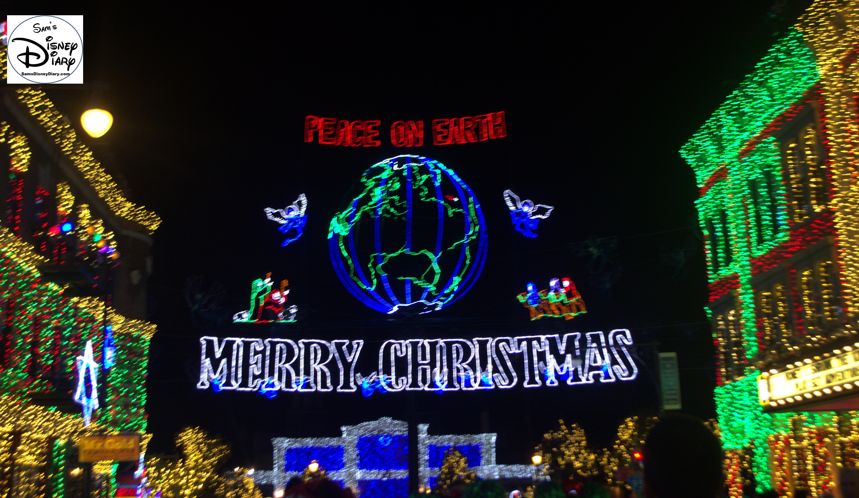 The Osborne Family Lights Feature Marquee - Peace on Earth (The red light on the globe is the original location of the lights, Little Rock, AZ)