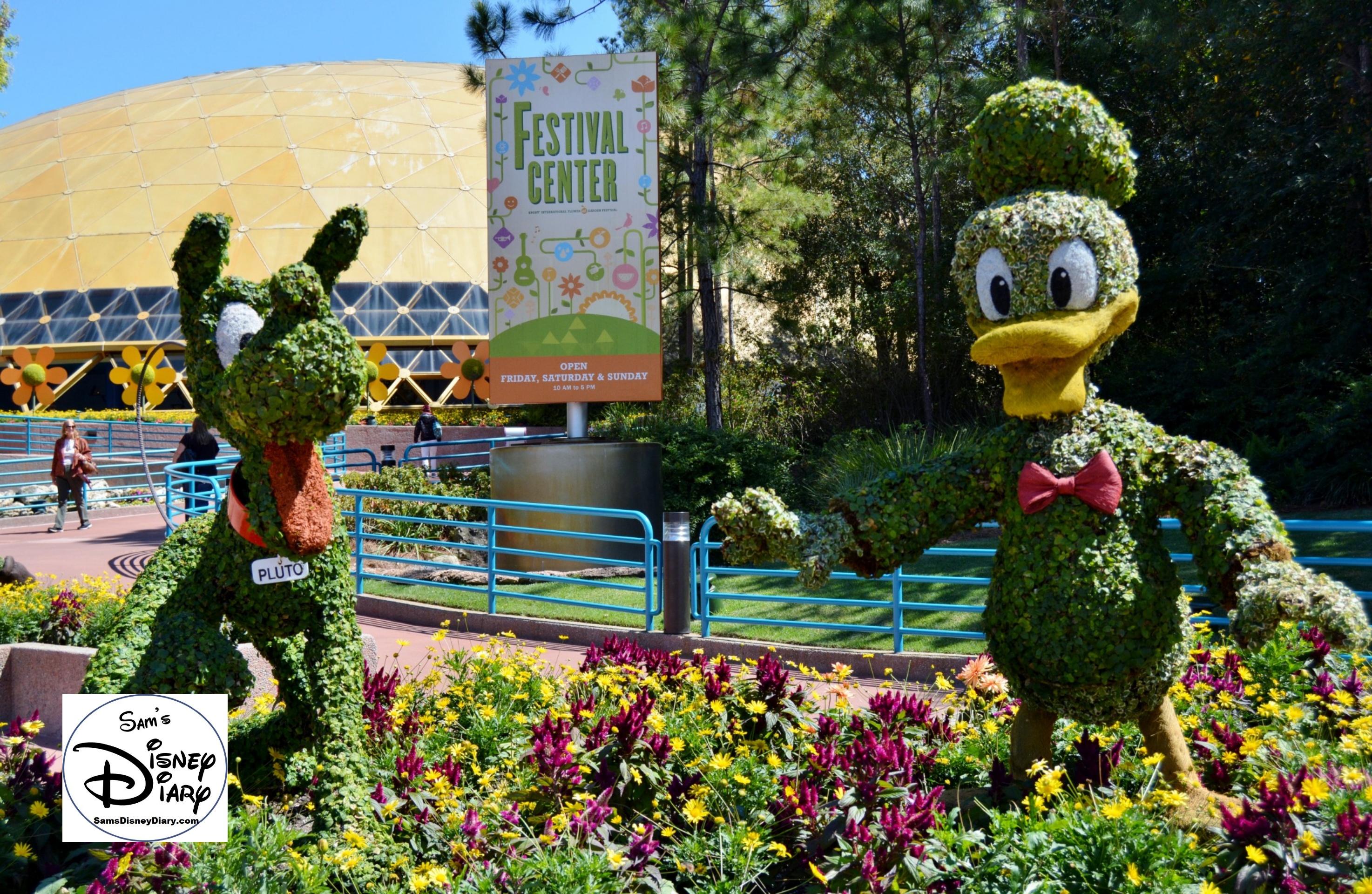 The 2017 Epcot International Flower and Garden Festival - Pluto and Donald outside of the Festival Center