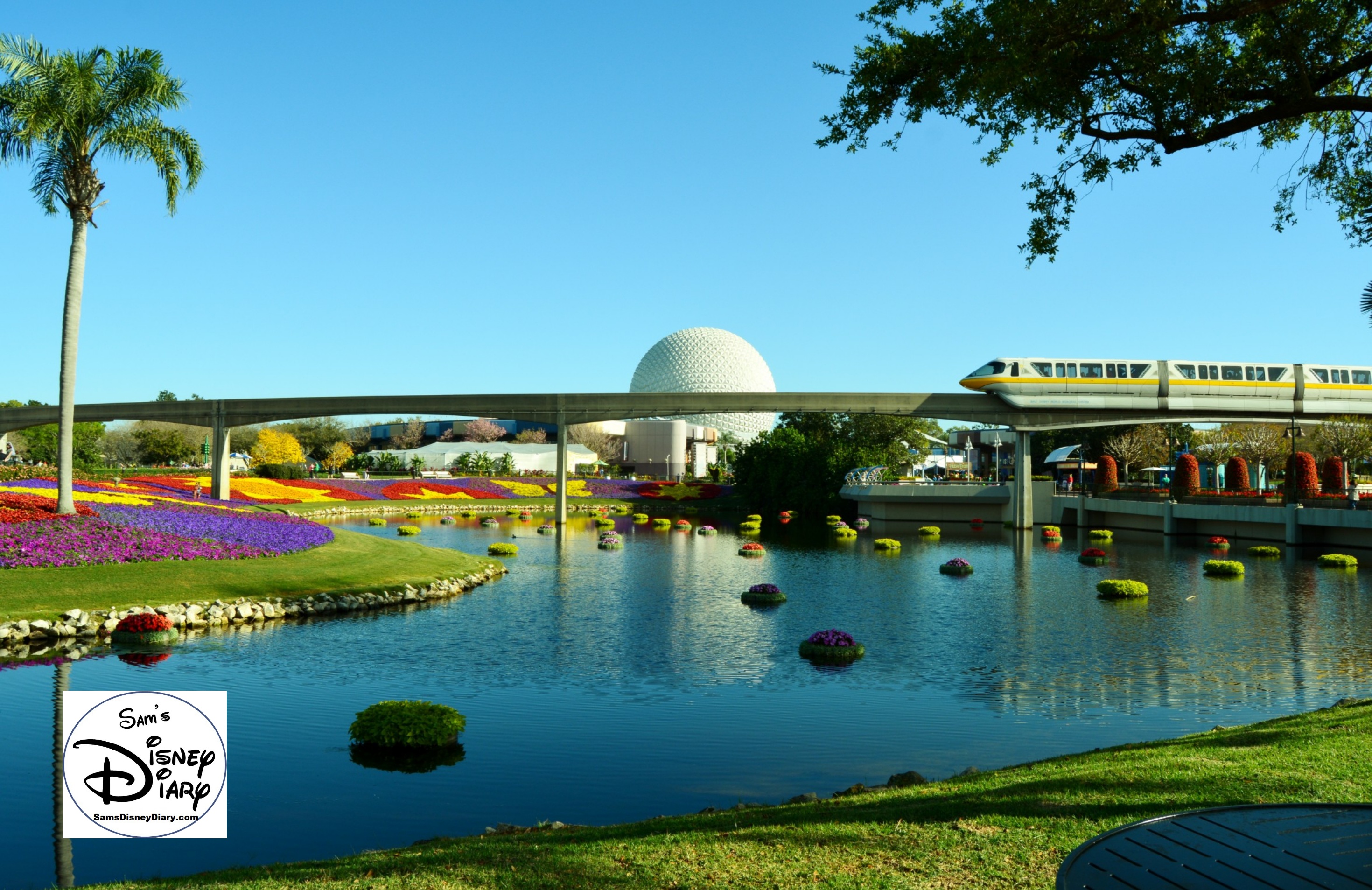 The 2017 Epcot International Flower and Garden Festival - Festival Blooms and a passing monorail