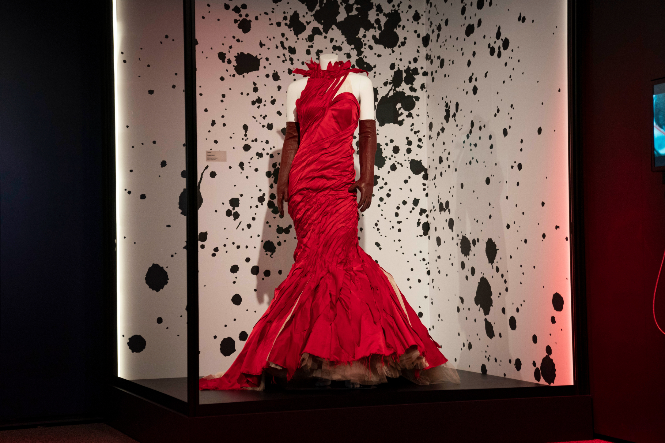 Costume worn by Emma Stone in the live-action film Cruella (2021) on display at Disney100: The Exhibition, now open at The Franklin Institute in Philadelphia. ©Disney