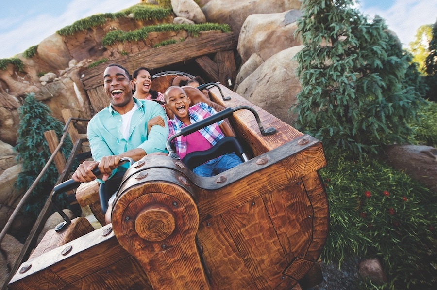 Best Roller Coasters for Kids at Disney Parks - image of small child and parent at Magic Kingdom Park on roller coaster