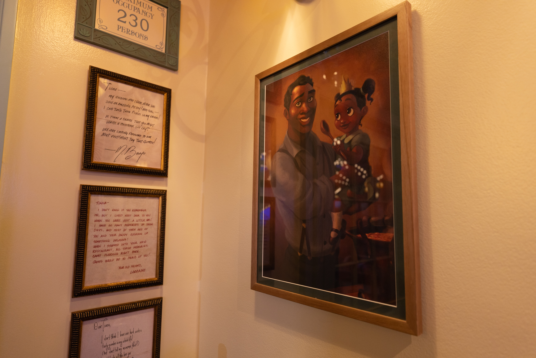 Guests will find a portrait of Tiana and her father, James, inside Tiana’s Palace, which will open in New Orleans Square at Disneyland Park in Anaheim, Calif., on Sept. 7, 2023. Inspired by the Walt Disney Animation Studios film “The Princess and the Frog,” the reimagined quick service restaurant will serve authentic New Orleans flavors inspired by Tiana’s friends and adventures. While Tiana’s Palace is not a character dining location, guests may find Tiana in New Orleans Square. (Christian Thompson/Disneyland Resort) 