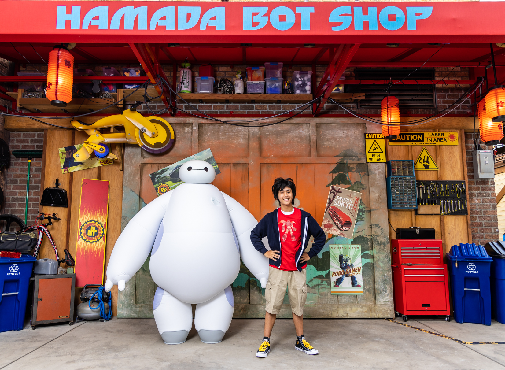 When guests step into San Fransokyo Square at Disney California Adventure Park in Anaheim, Calif., they may have the opportunity to interact with boy genius Hiro Hamada and his huggable healthcare companion robot, Baymax, outside the Hamada Bot Shop. This converted warehouse is where the Big Hero 6 team builds their hi-tech gear. (Christian Thompson/Disneyland Resort)