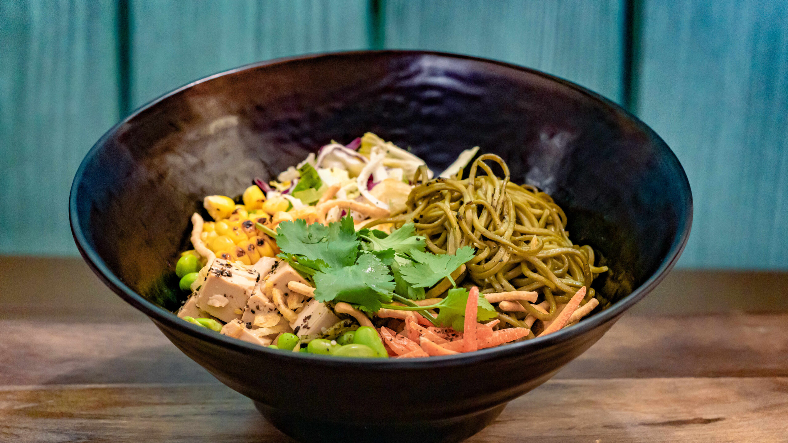 Soba Noodle Salad (Aunt Cass Café) – with tofu, cabbage, edamame, carrots, roasted corn, scallions, and cilantro topped with crispy shallots and sesame ginger dressing. Available later in summer 2023.For more details, visit DisneyParksBlog.com. (David Nguyen/Disneyland Resort)