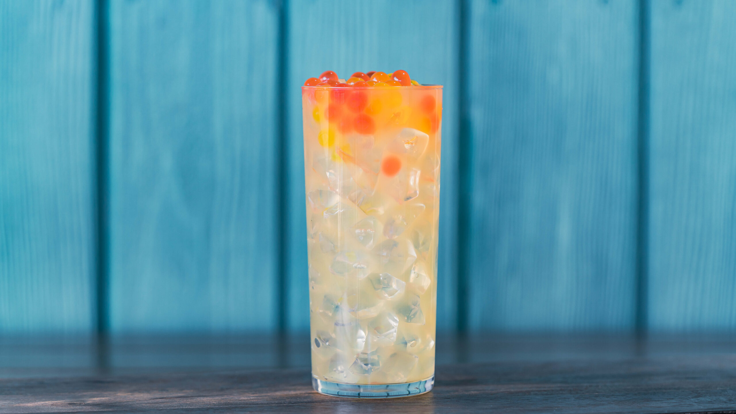 Honey Lemon-Ade (Aunt Cass Café) – Minute Maid Lemonade Zero Sugar and yuzu purée with passion fruit and strawberry popping spheres. Available later in summer 2023. For more details, visit DisneyParksBlog.com. (David Nguyen/Disneyland Resort)