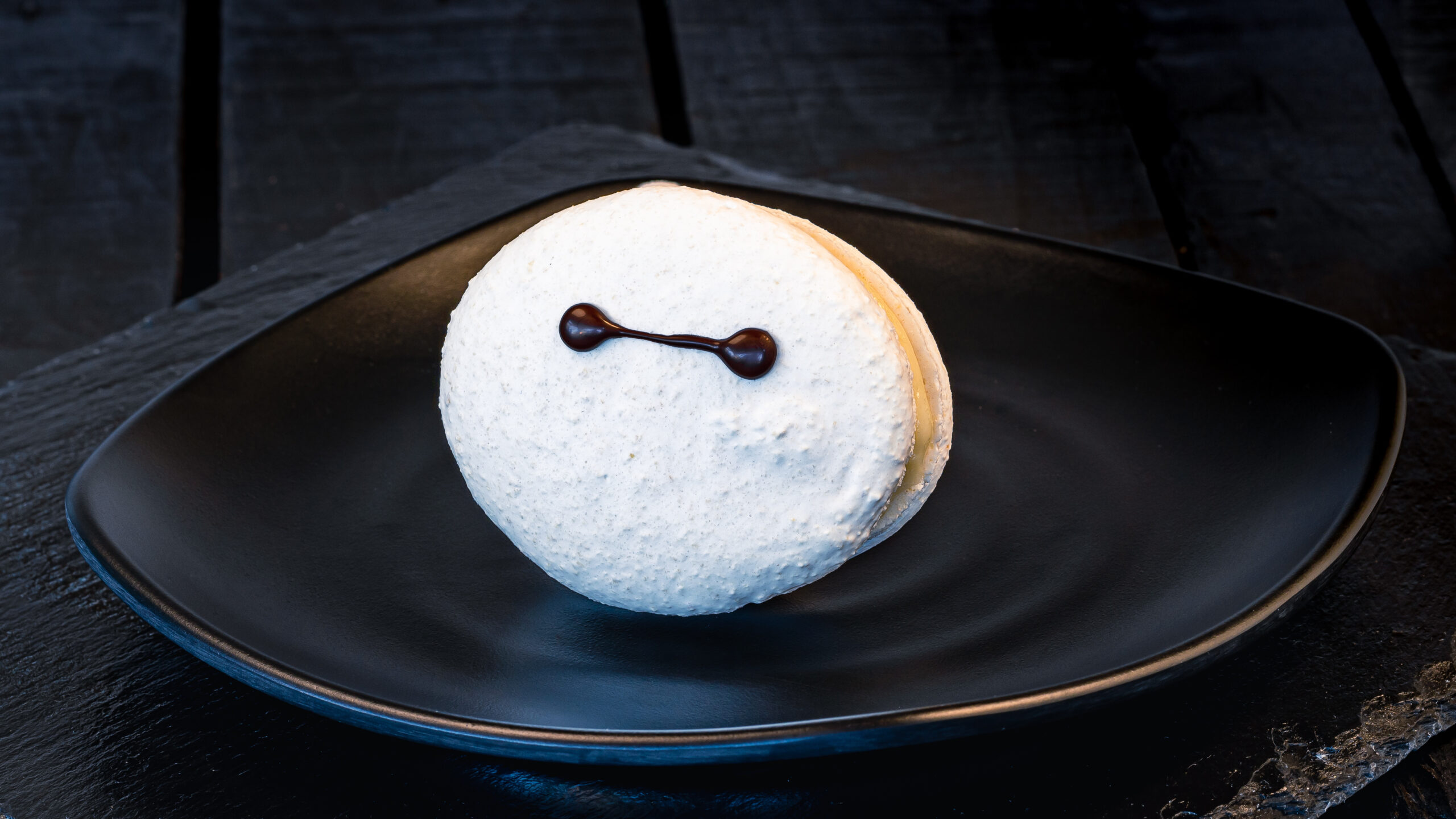 Baymax Macaron (Lucky Fortune Cookery) – filled with chocolate-hazelnut spread and buttercream. Available beginning July 19, 2023. For more details, visit DisneyParksBlog.com. (David Nguyen/Disneyland Resort)