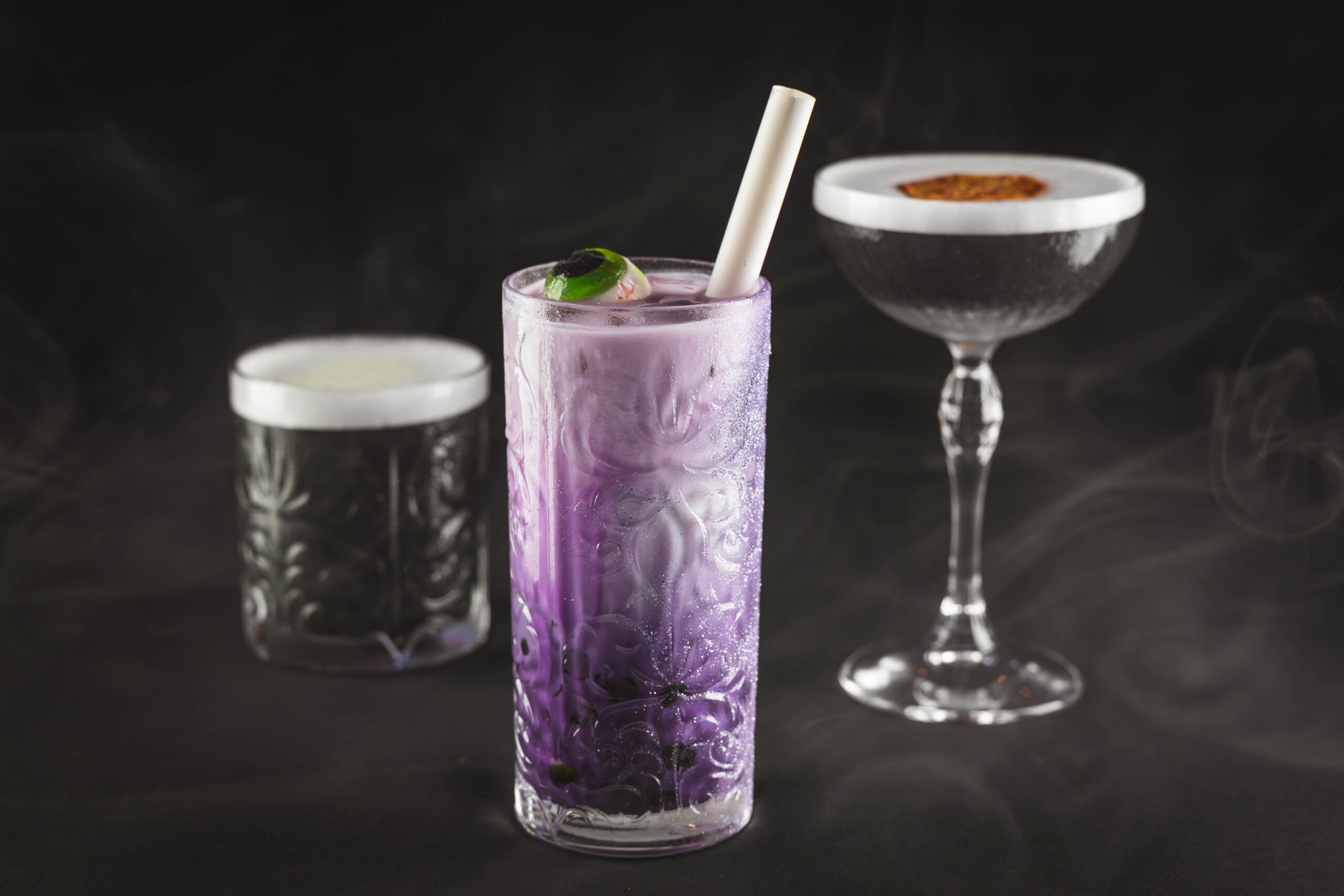 Disney Cruise Line reveals the Haunted Mansion Parlor, an all-new bar inspired by the iconic Disney Parks attraction, The Haunted Mansion. Foolish mortals will sip spirited craft cocktails among happy haunts for the first time inside this new venue on board the Disney Treasure when it sets sail in December 2024. (Mariah Wild, Photographer) ©Disney