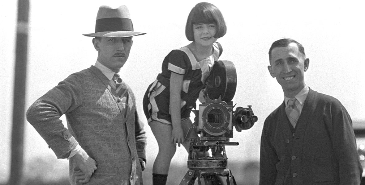 Walt Disney, Virginia Davis, and Roy Disney on the set of an Alice Comedy.