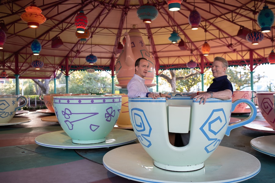 Peyton Manning and Phil Simms in Tea Cup at Walt Disney World, Magic Kingdom Park Hosts Special ESPN+ Peyton’s Places Look at ‘What’s Next?’ History