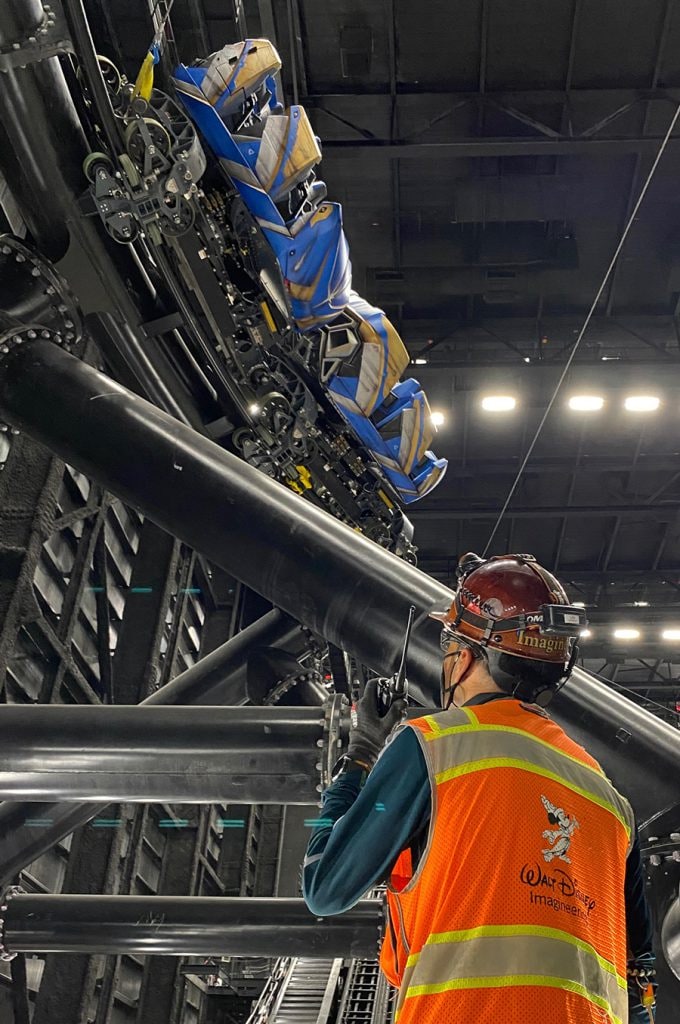 Guardians of the Galaxy: Cosmic Rewind Wins Award for Outstanding Attraction - imagineers inside show building inspect track and coaster ride vehicle