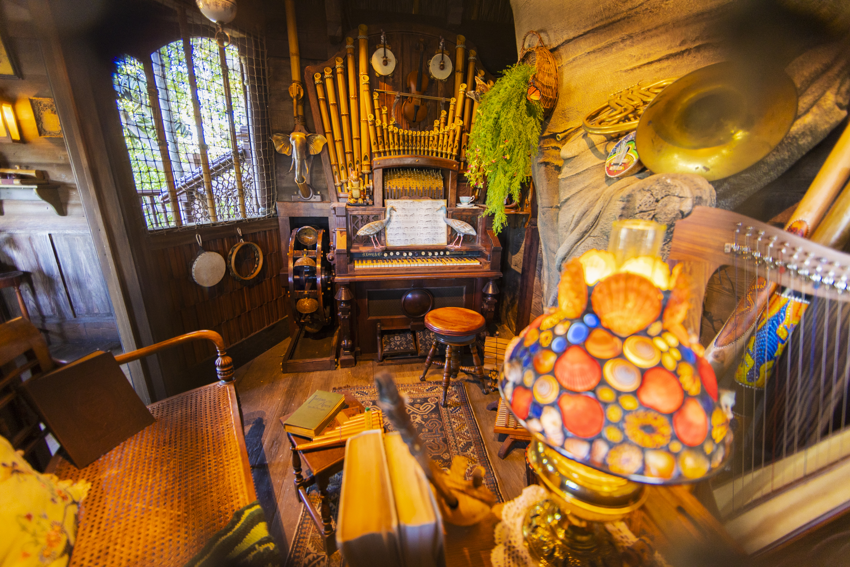 Paying tribute to the original treehouse that Walt Disney and his Imagineers built in 1962 for the movie “Swiss Family Robinson,” the Adventureland Treehouse inspired by Walt Disney’s Swiss Family Robinson will open in a fresh, new way Nov. 10, 2023, at Disneyland Park in Anaheim, Calif. The mother’s room is filled with musical instruments including a harp, lute, guitar and organ, which she plays to fill the home with cheerful melodies. (Christian Thompson/Disneyland Resort)