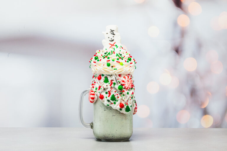NEW! Frosty the Snowman Shake is available throughout the holidays! • Mint chocolate chip ice cream adorned with red and green Christmas candies, sprinkles, and holiday mints topped with homemade whipped cream and a marshmallow snowman popping out with a candy cane