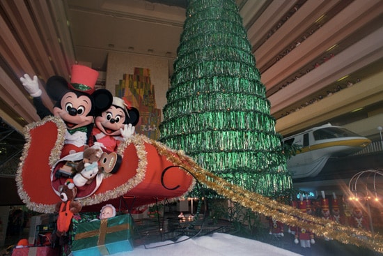 Mickey Mouse and Minnie Mouse in a red sleigh during Christmastime at Disney’s Contemporary Resort in 1989