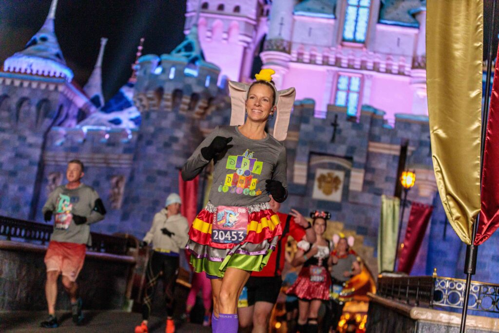 Runners make their way through Sleeping Beauty Castle at Disneyland Park in Anaheim during the Disneyland Half-Marathon on Jan. 14, 2023. Thousands of runners participated in the runDisney race, traversing a 13.1-mile course through Disney California Adventure Park and Disneyland, as well as iconic destinations in Anaheim. The race was the culmination of Disneyland Half-Marathon weekend, which included kids’ races, a 5K and 10K. (Sean Teegarden/Disneyland Resort)