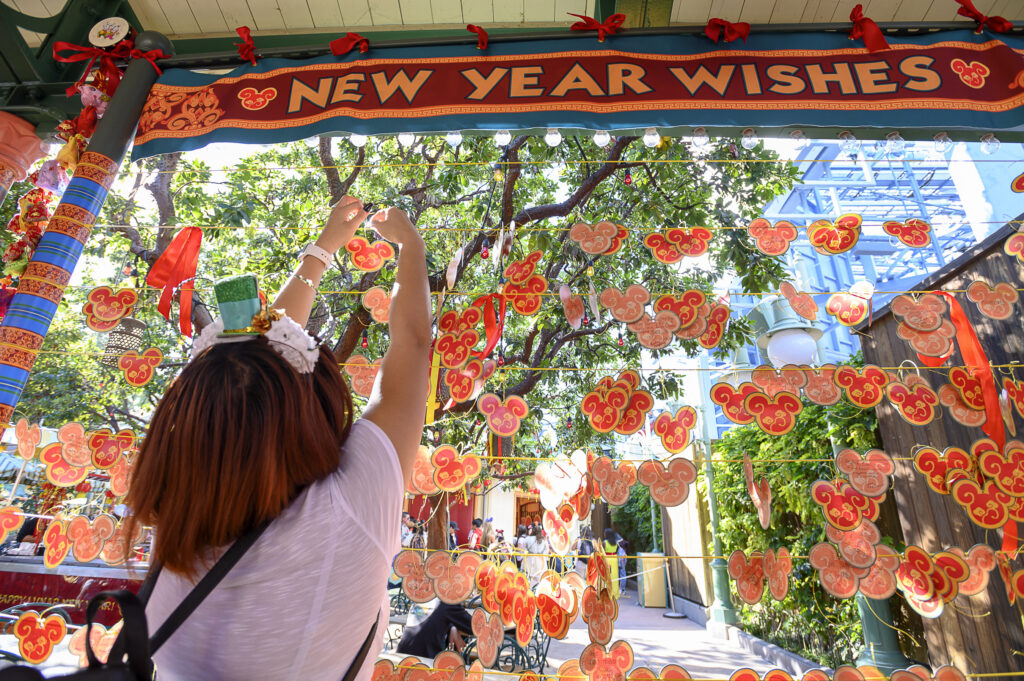 At the Lunar New Year Wishing Wall in Disney California Adventure Park in Anaheim, Calif., guests can stroll beneath strings of ornamental lanterns and share their messages of hope, health and happiness for this year. The Lunar New Year celebration is a joyous tribute to Chinese, Korean and Vietnamese cultures. At the celebration, guests can savor Asian-inspired dishes at Lunar New Year Marketplaces; experience dazzling entertainment such as “Mulan’s Lunar New Year Procession” to “Hurry Home – Lunar New Year Celebration,” and more. (Christian Thompson/Disneyland Resort)