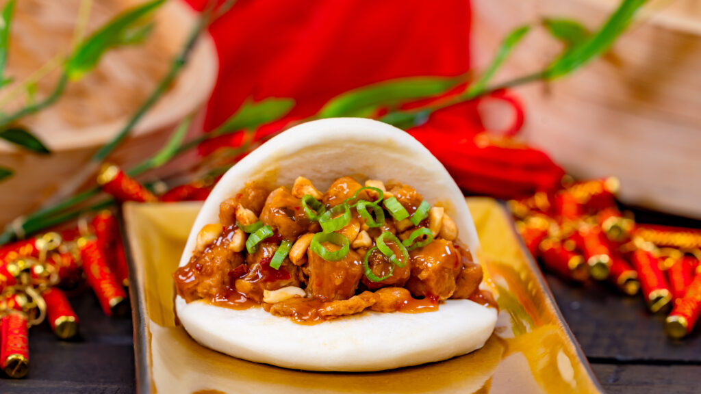 Kung Pao Bao (Prosperity Bao & Buns at Disney California Adventure Park in Anaheim, Calif.) – with chicken, toasted peanuts and scallions. Available beginning Jan. 23, 2024. For more details, visit DisneyParksBlog.com. (David Nguyen/Disneyland Resort)