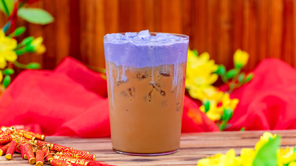 Taro Vietnamese-style Iced Coffee (Bamboo Blessings at Disney California Adventure Park in Anaheim, Calif.) – Joffrey’s Coffee & Tea Co. Vietnamese-style Coffee, cocoa powder and condensed milk garnished with a taro chocolate sweet cream. Available beginning Jan. 23, 2024. For more details, visit DisneyParksBlog.com. (David Nguyen/Disneyland Resort)