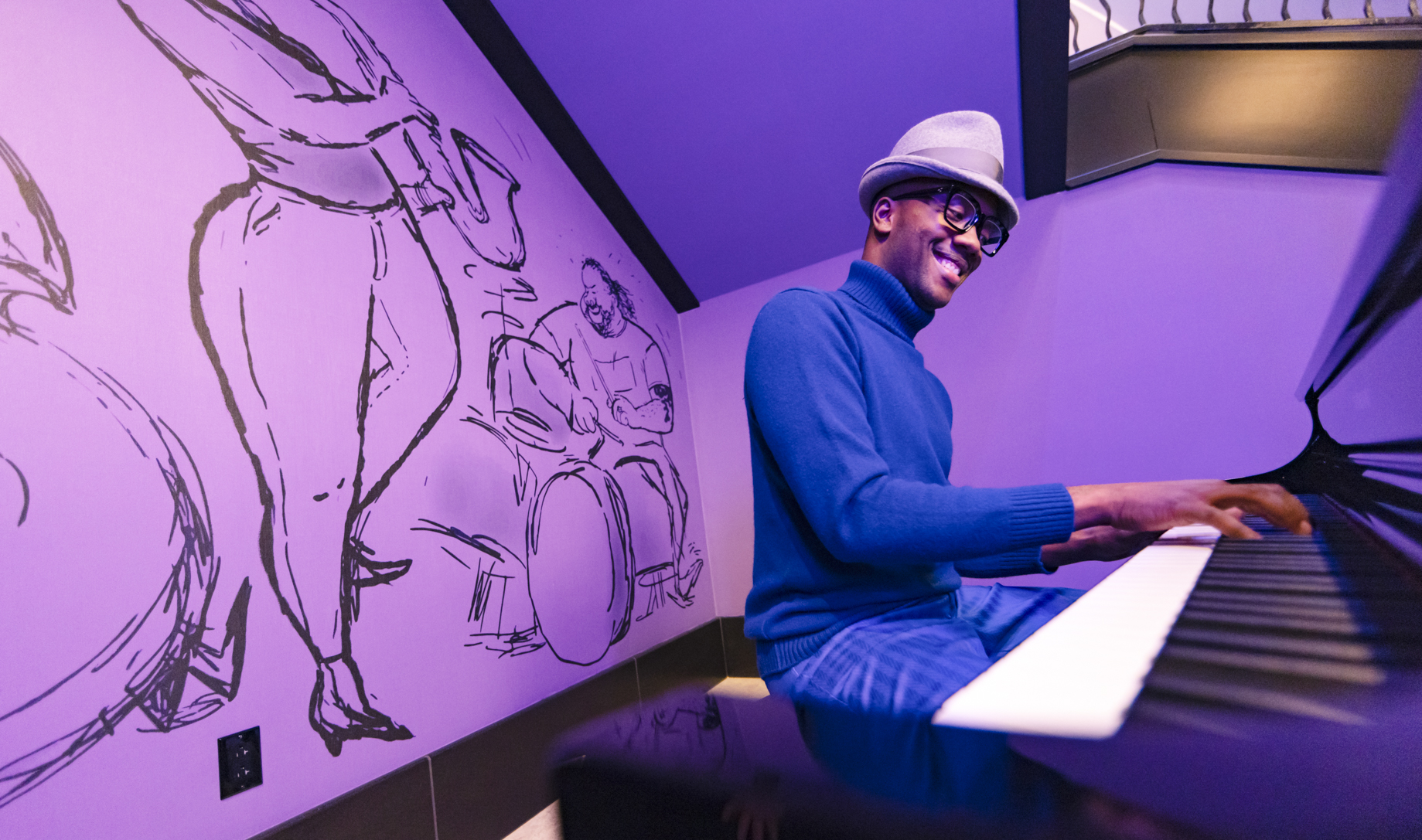 At select times, Joe Gardner from Pixar’s “Soul” drops by the hotel lobby to play piano for passing guests at Pixar Place Hotel at Disneyland Resort in Anaheim, Calif. Joe Gardner gets lost in the music surrounded by deep purple walls and drawings of jazz musicians and counselors from “The Great Before.” (Christian Thompson/Disneyland Resort)