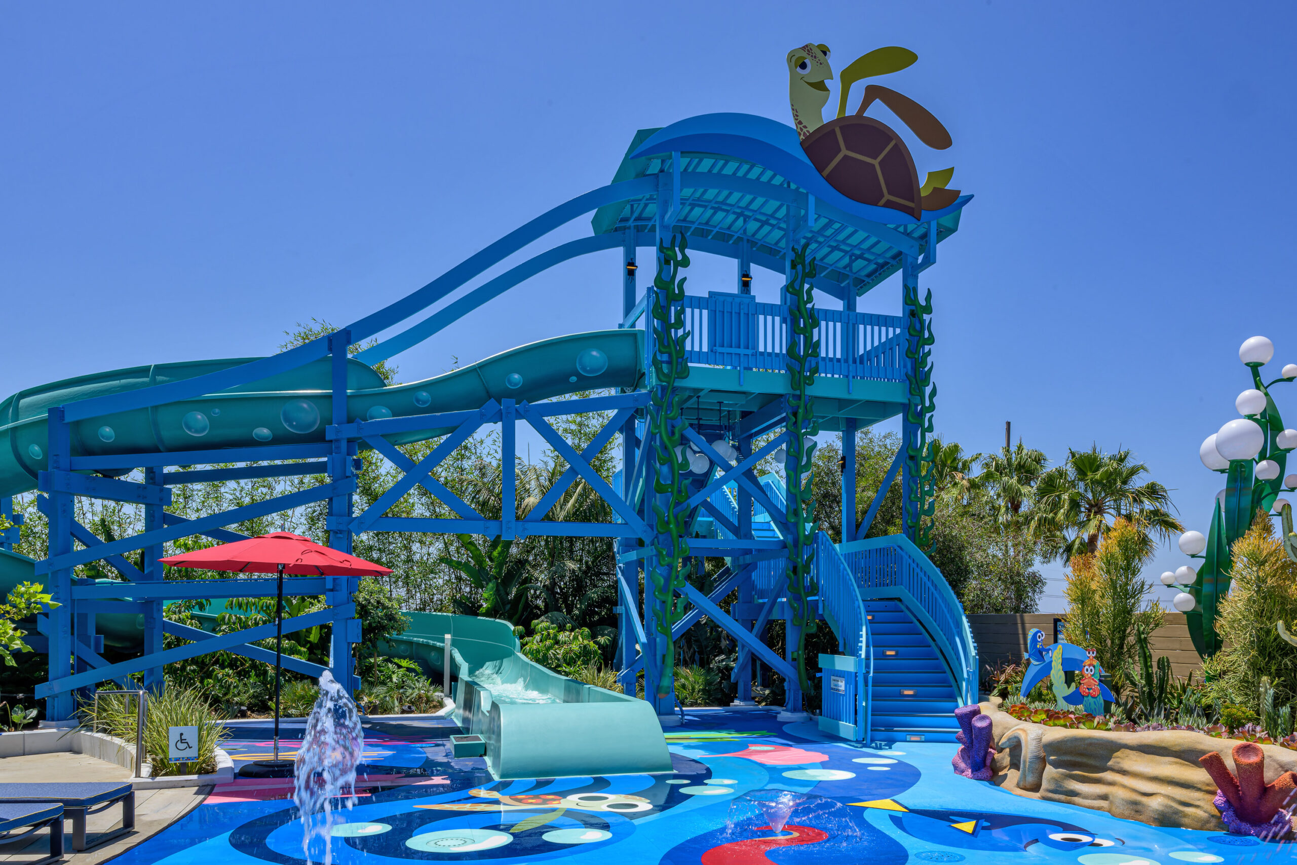 At Pixar Place Hotel at Disneyland Resort in Anaheim, Calif., hotel guests can enjoy a colorful water play area where families can take a winding water ride down the “Finding Nemo”-inspired Crush’s Surfin’ Slide. (Richard Harbaugh/Disneyland Resort)