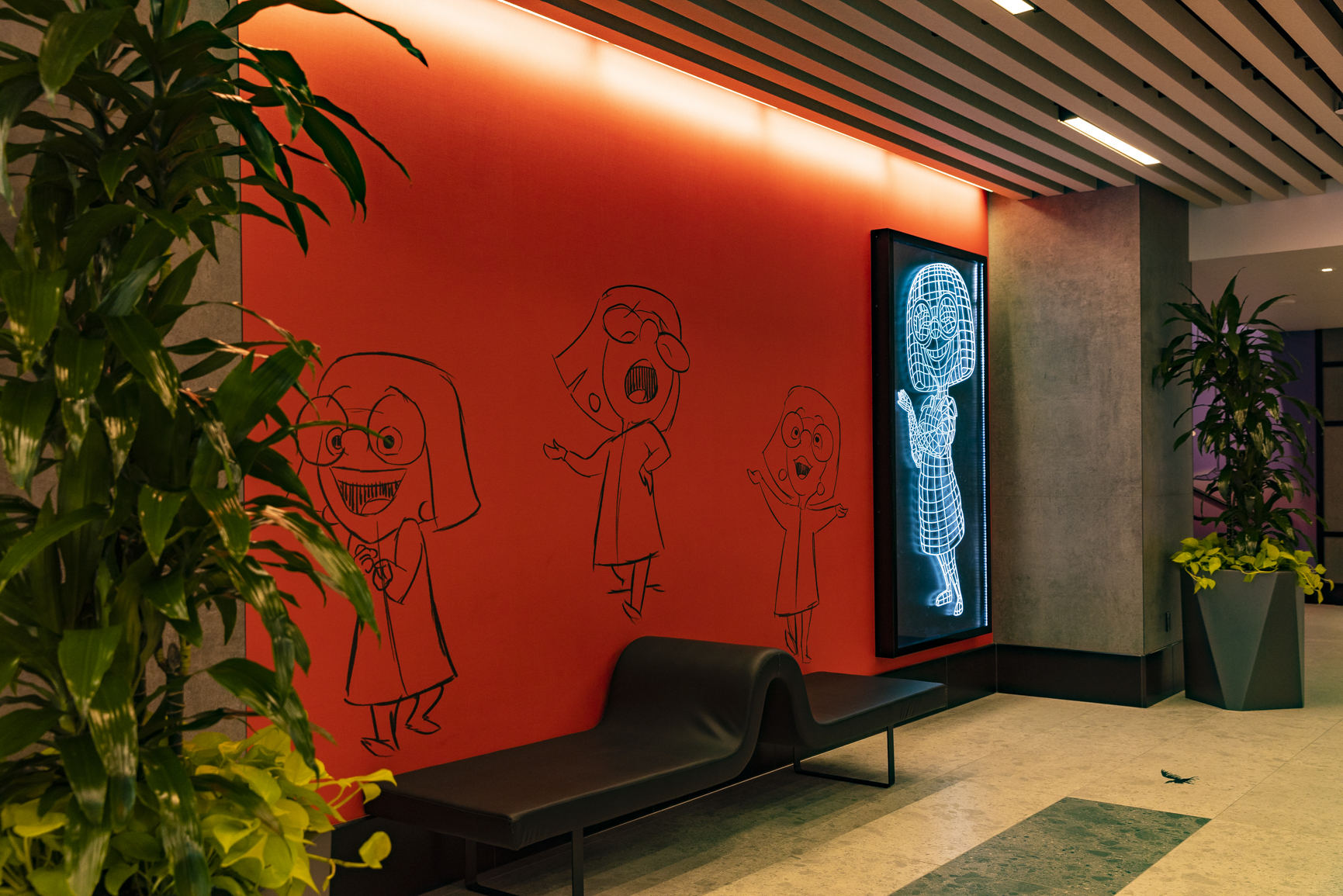 The rear entrance of Pixar Place Hotel at Disneyland Resort in Anaheim, Calif., welcomes guests with décor inspired by the stages of character design development as ideas go from pencil and paper illustrations to something built in the computer. (Christian Thompson/Disneyland Resort)