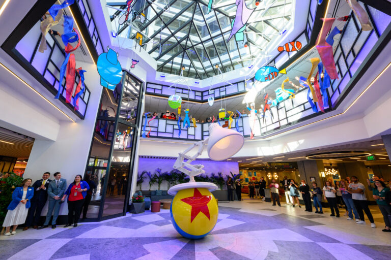 A sculpture of the iconic Pixar Ball and Lamp welcomes guests at the front lobby entrance of Pixar Place Hotel at Disneyland Resort in Anaheim, Calif., with an abstract mobile of Pixar characters floating from the skylight above. (Richard Harbaugh/Disneyland Resort)