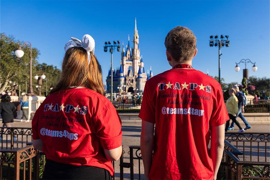 Two members of Tragedy Assistance Program for Survivors at Magic Kingdom Park looking at Cinderella Castle 