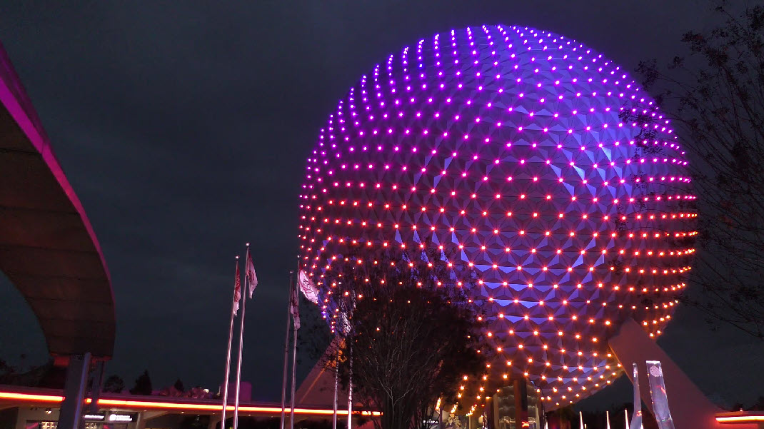 Epcot's iconic Spaceship Earth transforms with stunning lighting, now extending to World Celebration Garden, enchanting visitors at festivals