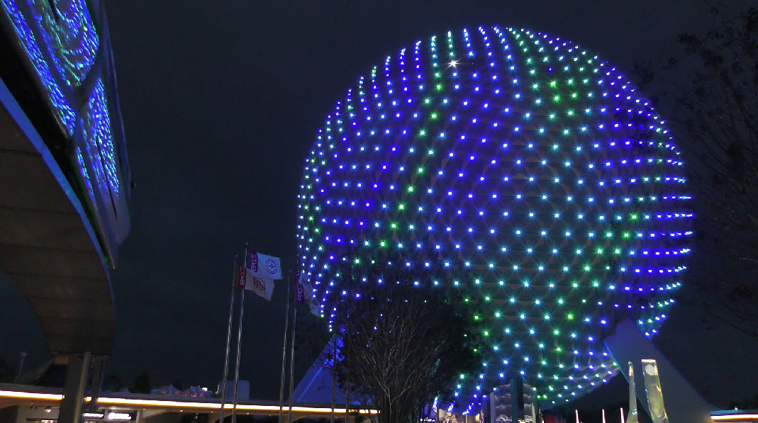 Epcot's iconic Spaceship Earth transforms with stunning lighting, now extending to World Celebration Garden, enchanting visitors at festivals