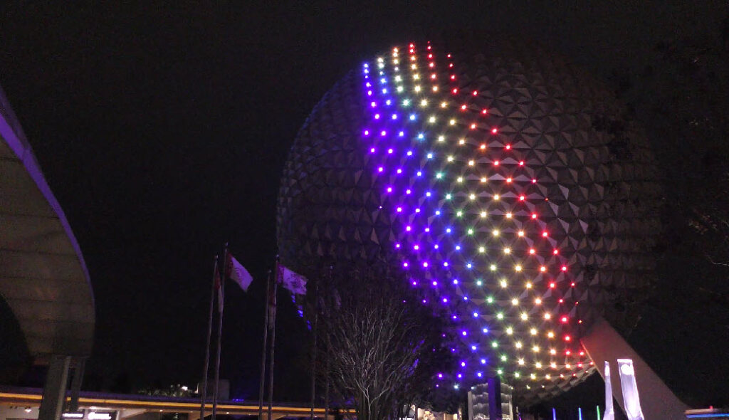 Epcot's iconic Spaceship Earth transforms with stunning lighting, now extending to World Celebration Garden, enchanting visitors at festivals