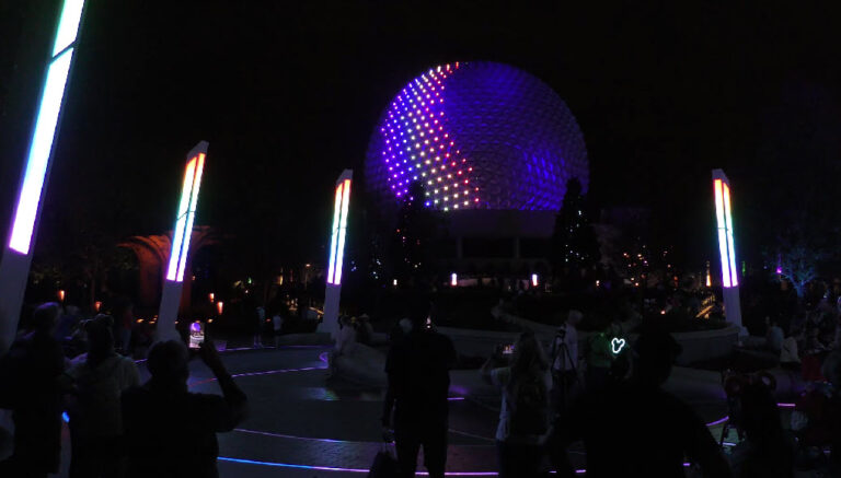 Epcot's iconic Spaceship Earth transforms with stunning lighting, now extending to World Celebration Garden, enchanting visitors at festivals