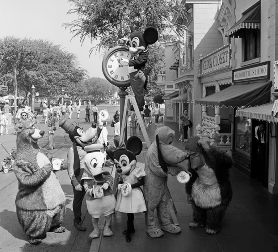 Image of Mickey and Friends on Main Street, U.S.A., changing the clock