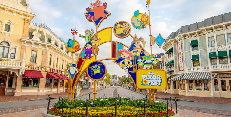 Colorful Pixar-inspired sculpture adorns flowered roundabout at Disneyland