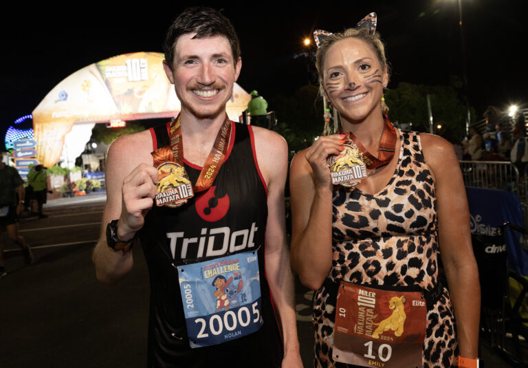 For the second consecutive year, overall Hakuna Matata 10-Miler winner Nolan McKenna of the Chicago area poses with women’s division winner Emily Hensel from the Pittsburgh area following their triumphant runs during runDisney Springtime Surprise Weekend on April 21, 2024, at Walt Disney World Resort in Lake Buena Vista, Fla. This year’s event focused on embracing adventure and marked the final on-site race weekend of the 2023-24 runDisney race season. (Mark Ashman, photographer)