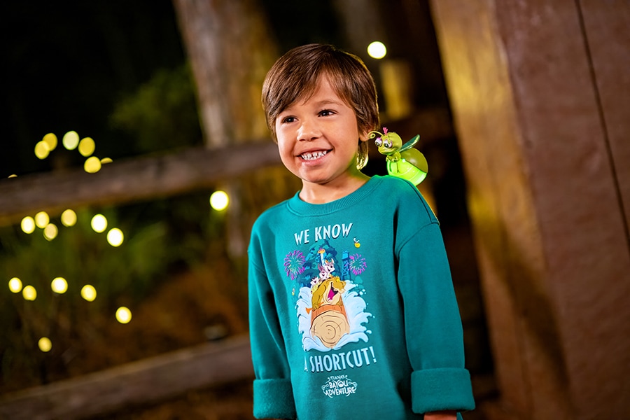 Boy smiling in Tiana's Bayou Adventure Apparel