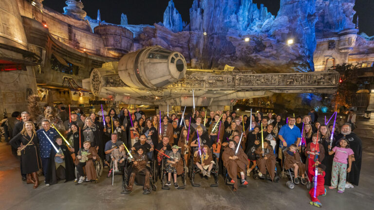 Guests at Blaze Your Path: A Star Wars Adventure pose inside Star Wars: Galaxy