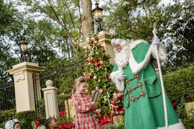 Santa greets a guest at EPCOT