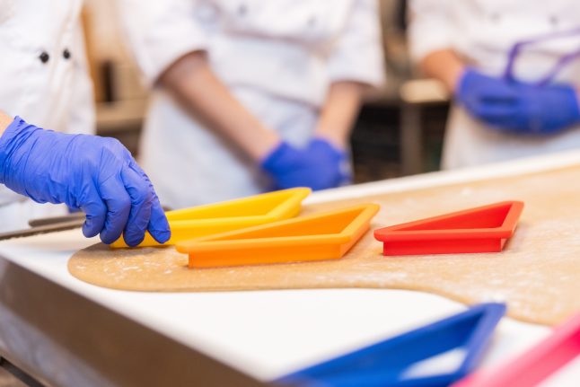 EPCOT Pastry team making gingerbread triangles 