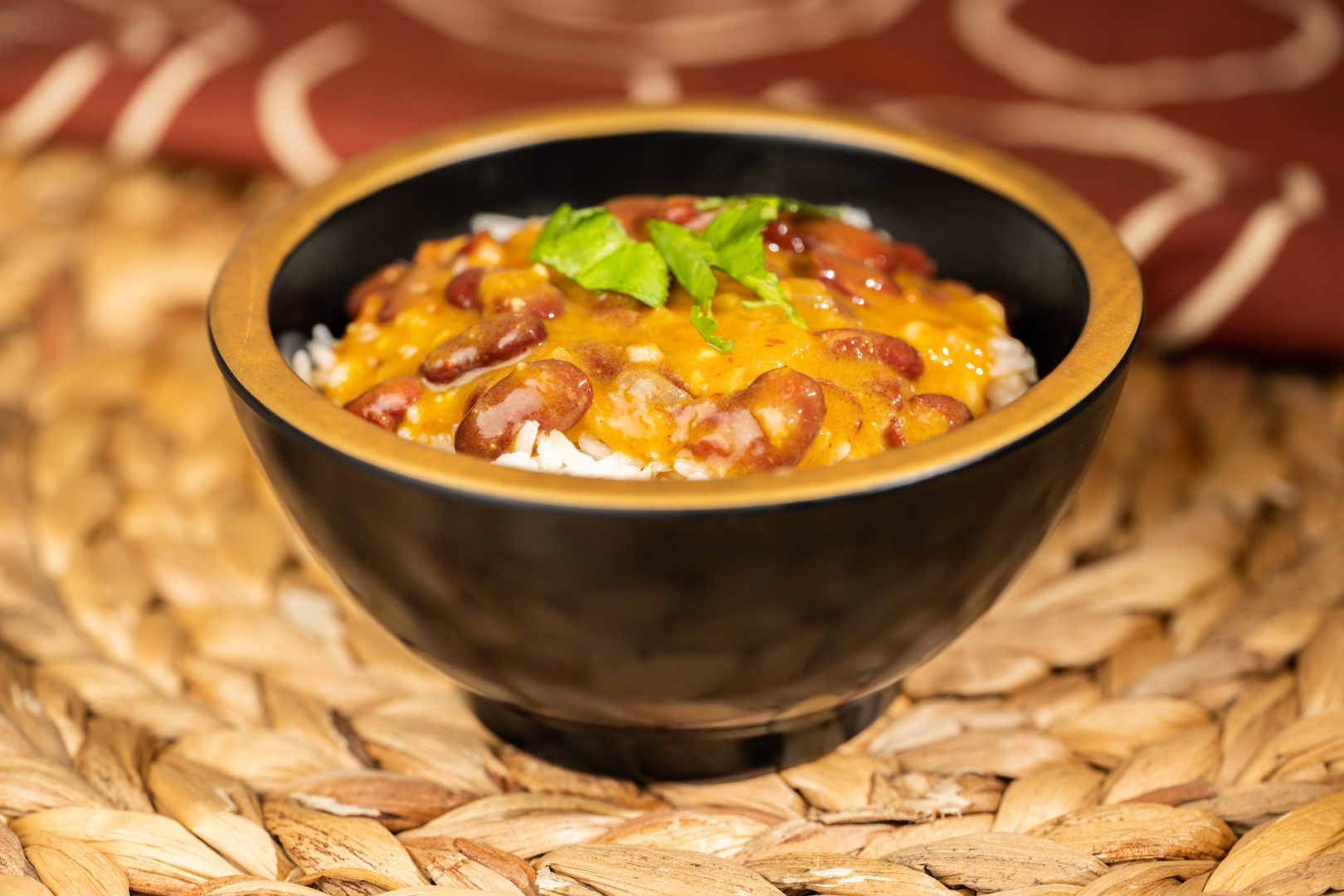 Journey Across Africa: Savory red beans cooked in coconut milk with ginger, turmeric, coriander, and tomato served over white rice