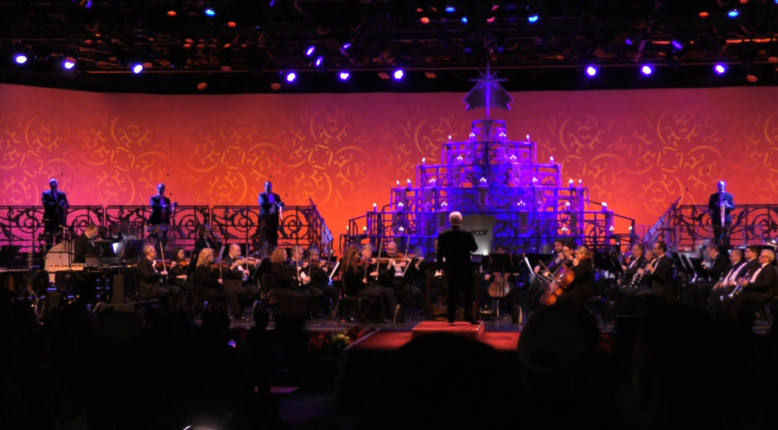 Jodi Benson lights up the stage as she narrates the story of Christmas during the final 2024 Candlelight Processional at EPCOT’s Festival of the Holidays