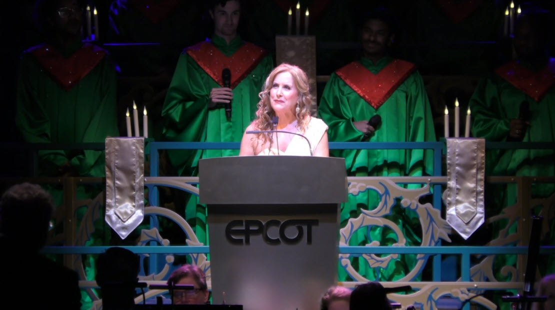 Jodi Benson lights up the stage as she narrates the story of Christmas during the final 2024 Candlelight Processional at EPCOT’s Festival of the Holidays