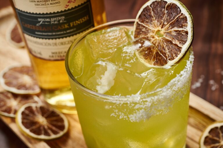 Snake Eyes cocktail includes Ojo de Tigre mezcal, banana liqueur, coconut, lime juice and a half salt rim