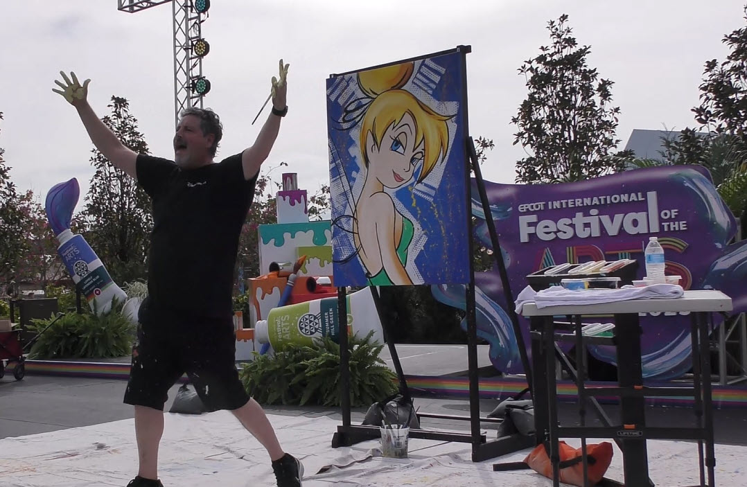 Trevor Carlton brings 'Sassy Tink' to life with bold colors and high-energy artistry during his live performance at the 2025 EPCOT Festival of the Arts in CommuniCore Plaza