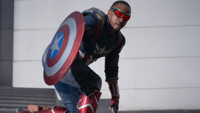 Captain America (Anthony Mackie) crouches and holds his vibranium shield in Captain America: Brave New World.