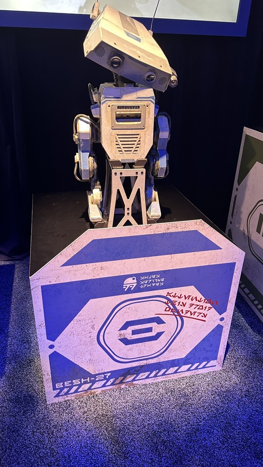 BESH-27, the curious and adventurous blue BDX droid, scans the environment at Star Wars: Galaxy’s Edge. Known for leading the trio through Black Spire Outpost, BESH-27 is always eager to explore the unknown.