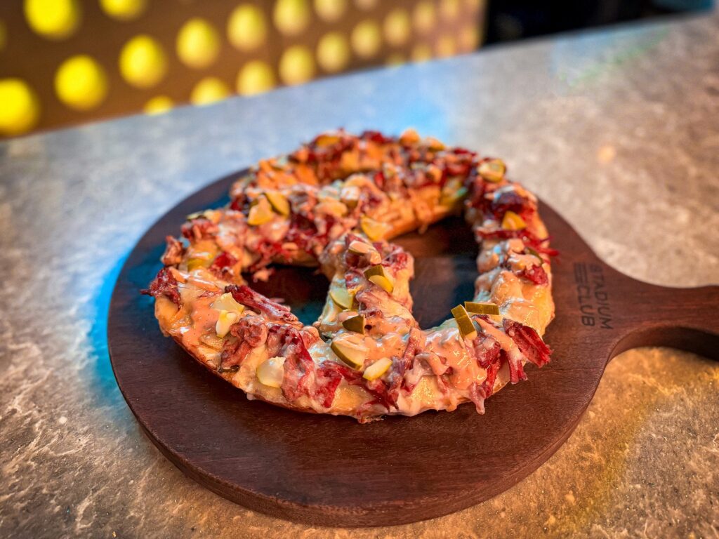 Reuben-Style Pretzel at Stadium Club – A jumbo pretzel topped with corned beef, sauerkraut, and Swiss cheese.